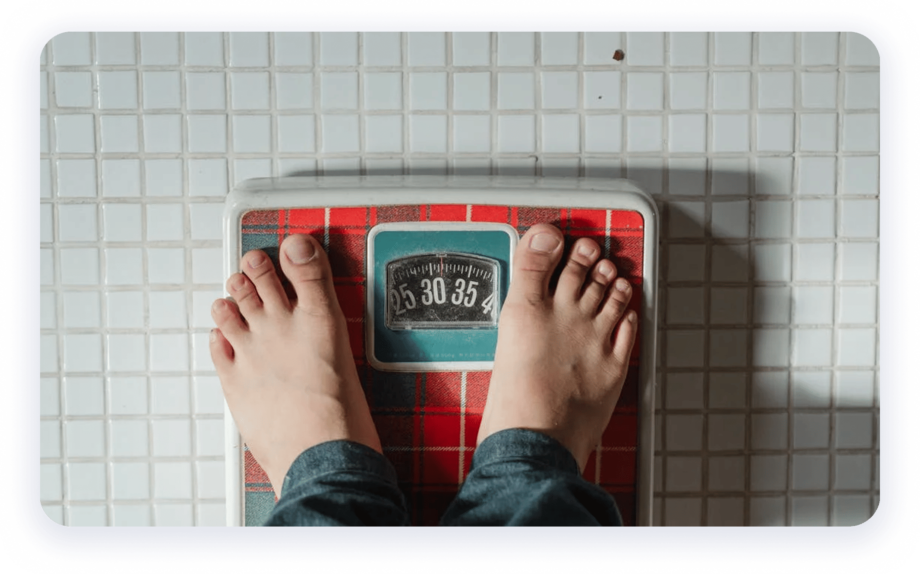 Person checking weight on scale